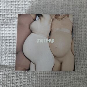 SKIMS seamless sculpt maternity bodysuit mid thigh